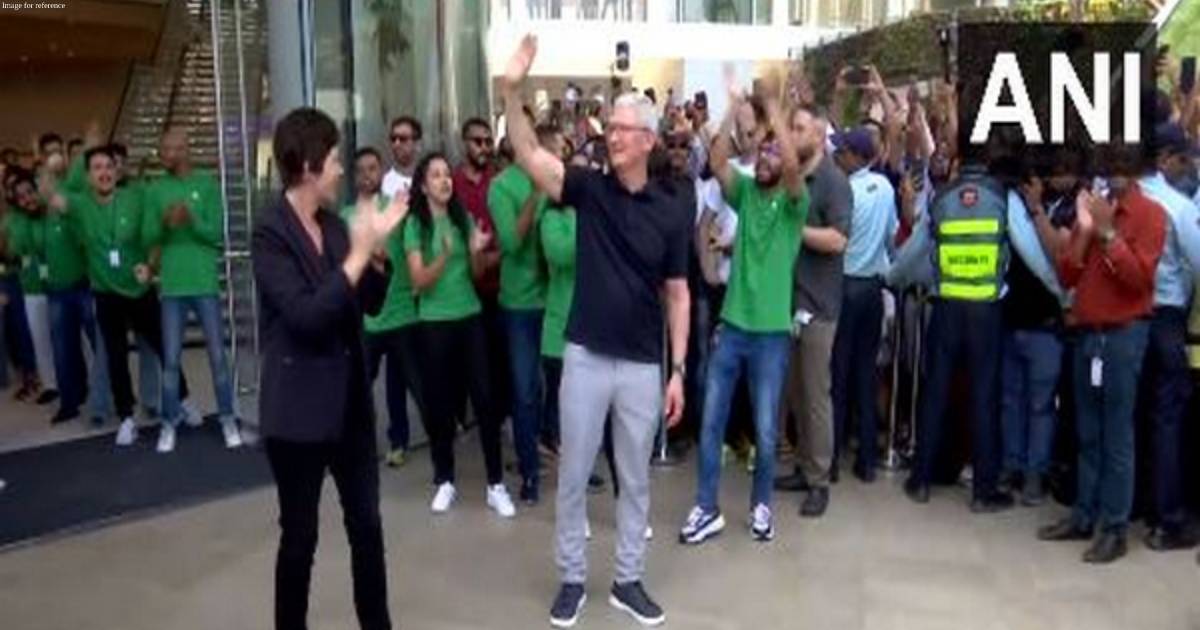 Apple CEO Tim Cook opens India's first retail store in Mumbai, poses with customers for selfies
